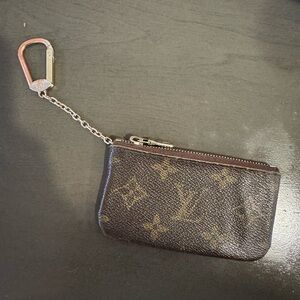 Authentic Louis Vuitton key pouch. Please note that the canvas is ripped.